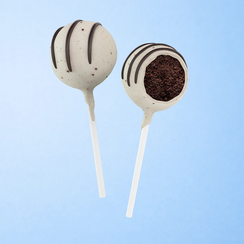 A moist chocolate cake with crumbled chocolate cookie bits, dipped in white chocolate and cookie crumbles.