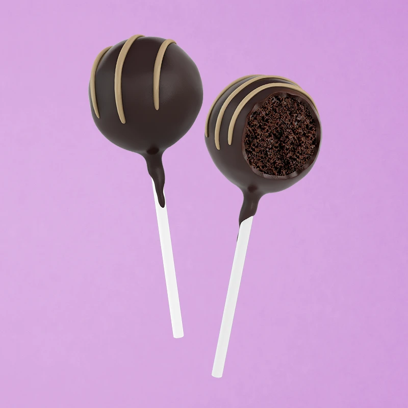 A decadent chocolate cake with a rich ganache and chocolate chips dipped in dark chocolate.